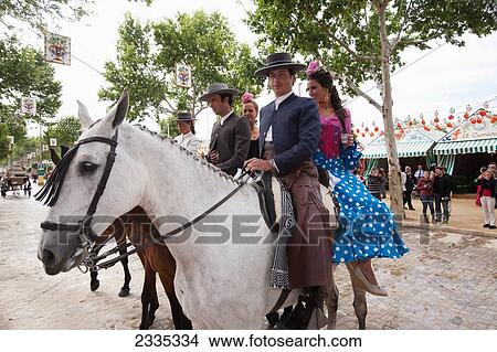 Horse Riders In Traditional Clothes During April Feria Festival; Seville, Andalucia, Spain View Large Photo Image Picture - Horse Riders In Traditional Clothes During April Feria Festival; Seville, Andalucia, Spain. Fotosearch