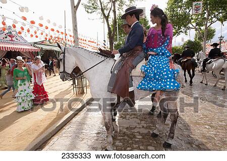 Horse Riders In Traditional Clothes During April Feria Festival; Seville, Andalucia, Spain View Large Photo Image Stock Image - Horse Riders In Traditional Clothes During April Feria Festival; Seville, Andalucia, Spain. Fotosearch