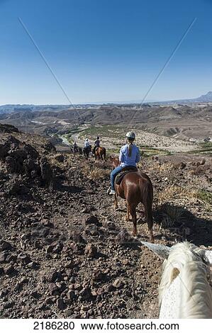 Stock Image - Horseback Riding In Big Bend Ranch State Park, Texas, Usa. Fotosearch