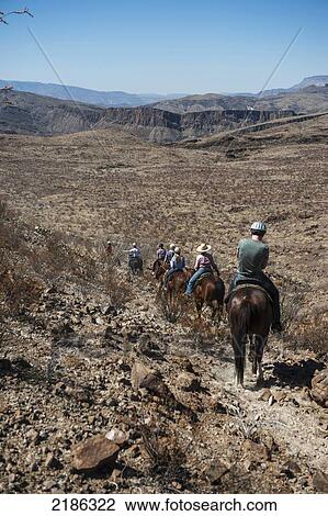 Stock Image - Horseback Riding In Big Bend Ranch State Park, Texas, Usa. Fotosearch
