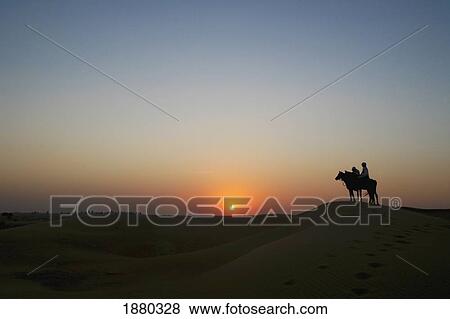 Stock Photo - Horseriding In United Arab Emirates.. Fotosearch