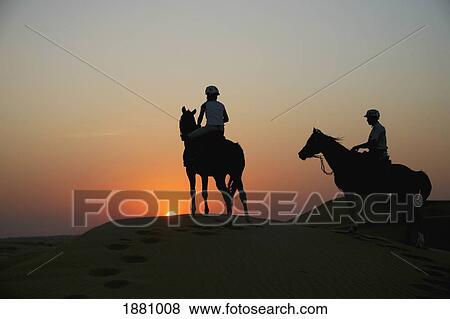 Stock Photo - Horseriding In United Arab Emirates.. Fotosearch