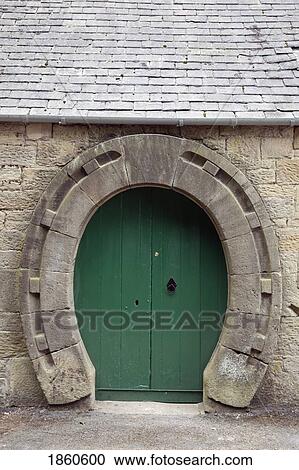 Stock Image - Horseshoe-Shaped Door, Ford And Etal; Northumberland, England. Fotosearch