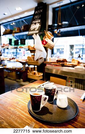 Hot drinks on a tray in cafe Del Aziz, Fulham; London, England View Large Photo Image Stock Photography - Hot drinks on a tray in cafe Del Aziz, Fulham; London, England. Fotosearch