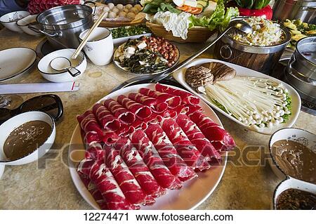 Stock Image - Hot pot meal at a Korean restaurant, Ulaanbaatar (Ulan Bator), Mongolia. Fotosearch