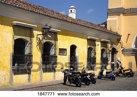 Stock Image - Hotel Convento Santa Catalina, Antigua, Guatemala, Central America; Motorcycles Outside Hotel. Fotosearch