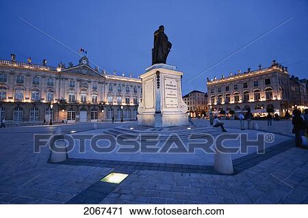 Stock Image - Hotel De Ville (City Hall) And Statue Of Stanislas Leszczynski, King Of Poland, Created By Georges Jacquot In The Center Of Place Stanislas At Night,, Nancy, France. Fotosearch