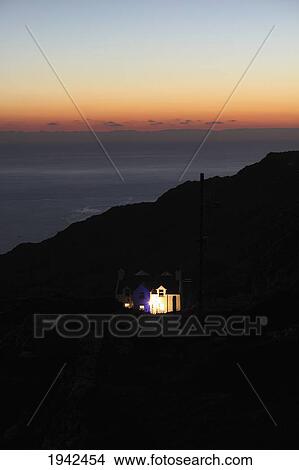 Picture - House Illuminated At Night On Sheep's Head Peninsula; County Cork Ireland. Fotosearch