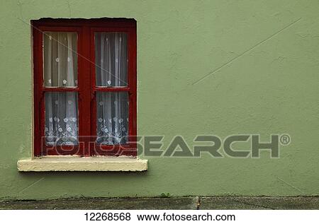 Stock Photo - House window in Kilgarvan village on the Ring of Kerry or Iveragh peninsula; County Kerry, Ireland. Fotosearch