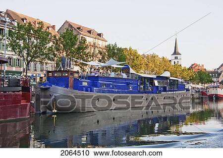 Stock Image - Houseboat In The Ill River Along The Fishermen Wharf, Strasbourg, France. Fotosearch