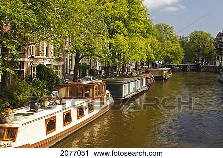 Stock Image - Houseboats On Brouwersgracht; Amsterdam Netherlands. Fotosearch