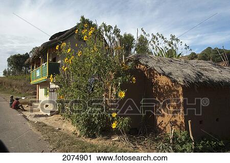 Stock Image - Houses Along The Road Between Ambositra & Ambavalao, Fianarantsoa Province, Madagascar. Fotosearch