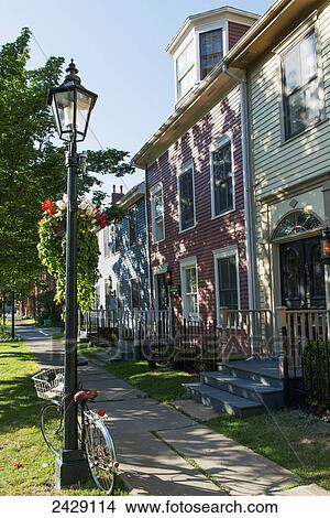 Picture - Houses and a lamp post in a neighbourhood; Prince Edward Island, Canada. Fotosearch