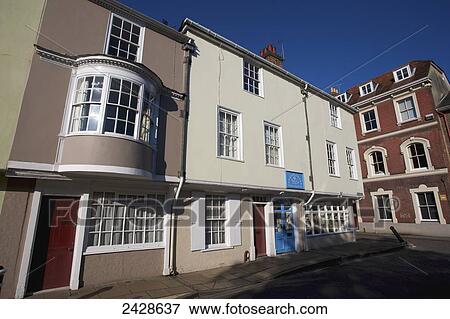 Houses and shops along a street in the old town of Kingsgate; Winchester, Hampshire, England View Large Photo Image Stock Photo - Houses and shops along a street in the old town of Kingsgate; Winchester, Hampshire, England. Fotosearch