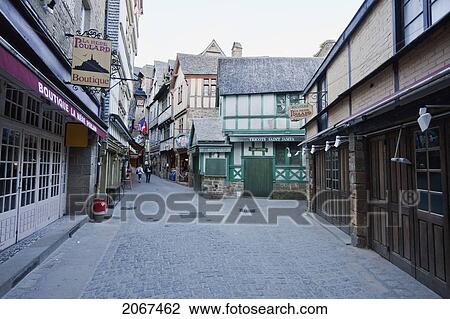 Houses And Stores In The Fortified Village Along Grande Rue, Main Street Of Mont Saint-Michel, France View Large Photo Image Stock Image - Houses And Stores In The Fortified Village Along Grande Rue, Main Street Of Mont Saint-Michel, France. Fotosearch