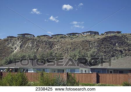 Stock Photography - Houses Behind Fence; Penticton, British Columbia, Canada. Fotosearch