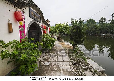 Stock Image - Houses by Nanhu Lake, Hongcun, Anhui, China. Fotosearch