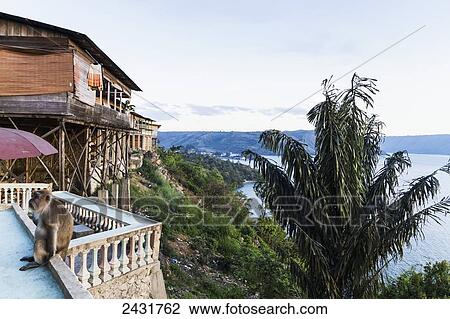 Stock Image - Houses of a cliff, Siuhan, North Sumatra, Indonesia. Fotosearch