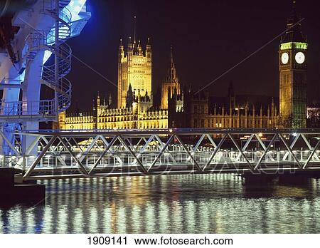 Stock Image - Houses Of Parliament And Millenium Wheel (London Eye). London, England.. Fotosearch