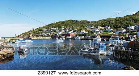 Stock Photo - Houses on a hill and boats in the harbour; St. John's, Newfoundland and Labrador, Canada. Fotosearch