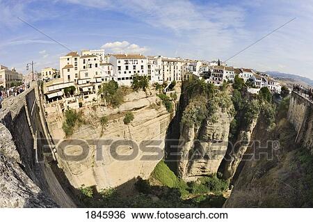 Stock Photograph - Houses On Edge Of Tajo Gorge; Ronda, Malaga Province, Spain. Fotosearch