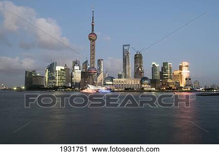 Stock Image - Huangpu River And Pudong Skyline At Dusk. Fotosearch