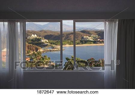 Stock Photo - Huatluco, Mexico; A View Of Las Brisas Resort From A Hotel Room Window. Fotosearch