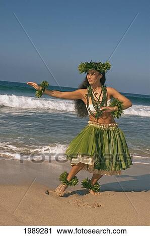 Hula Dancer In Ti-Leaf Skirt, Haku, Lei, In A Dancing Pose On The Beach View Large Photo Image Stock Image - Hula Dancer In Ti-Leaf Skirt, Haku, Lei, In A Dancing Pose On The Beach. Fotosearch