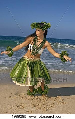 Hula Dancer In Ti-Leaf Skirt, Haku, Lei, In A Dancing Pose On The Beach View Large Photo Image Stock Photography - Hula Dancer In Ti-Leaf Skirt, Haku, Lei, In A Dancing Pose On The Beach. Fotosearch