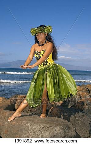Hula Dancer With Haku Lei In Traditional Outfit On Rocky Coast, Ocean Background View Large Photo Image Stock Image - Hula Dancer With Haku Lei In Traditional Outfit On Rocky Coast, Ocean Background. Fotosearch