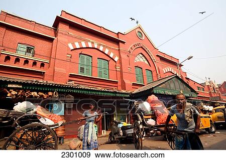 Human rickshaws transporting goods at famed New Market near Sudder Street, a popular backpacker budget accommodation district of Calcutta / Kolkata, the capital of West Bengal State, India, Asia. View Large Photo Image Stock Photo - Human rickshaws transporting goods at famed New Market near Sudder Street, a popular backpacker budget accommodation district of Calcutta / Kolkata, the capital of West Bengal State, India, Asia.. Fotosearch