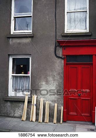 Hurling Sticks Outside Doorway Of House, Close Up View Large Photo Image Picture - Hurling Sticks Outside Doorway Of House, Close Up. Fotosearch