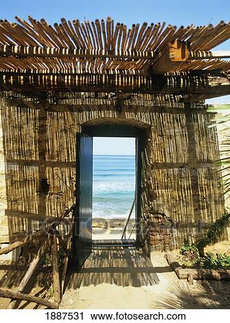 Stock Image - Hut On Beach. Fotosearch