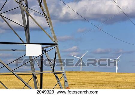 Hydro Transmission Lines And Tower, With Wind Energy Farm In Background, St. Leon, Manitoba View Large Photo Image Stock Photo - Hydro Transmission Lines And Tower, With Wind Energy Farm In Background, St. Leon, Manitoba. Fotosearch