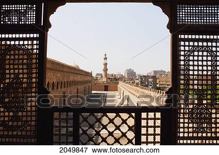 Stock Photo - Ibn Tulun Mosque, As Seen Through A Wooden Mashrabeya Screen On The Roof Terrace Of The Gayer Anderson Museum, Cairo, Al Qahirah, Egypt. Fotosearch