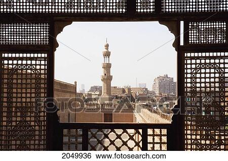 Stock Photograph - Ibn Tulun Mosque, As Seen Through A Wooden Mashrabeya Screen On The Roof Terrace Of The Gayer Anderson Museum, Cairo, Al Qahirah, Egypt. Fotosearch