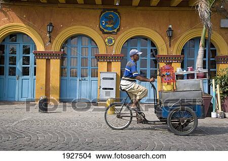 Picture - Ice Cream Seller Cycling. Fotosearch