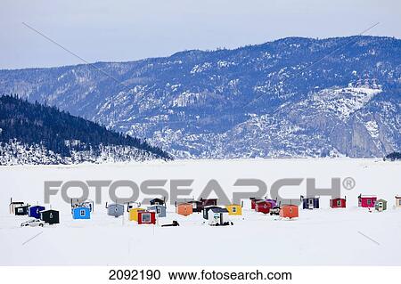 Stock Image - Ice Fishing Huts On Saguenay River; Saguenay Lac-Saint-Jean Quebec Canada. Fotosearch