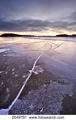 Stock Image - Ice Forming On The Red River, Near East Selkirk, North Of Winnipeg, Manitoba. Fotosearch