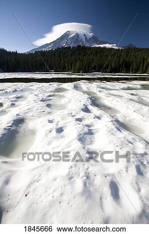 Stock Photograph - Ice Over Reflection Lake; Mt Rainier National Park, Washington State, Usa. Fotosearch