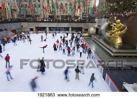 Stock Image - Ice Skaters In Rockefeller Center. Fotosearch