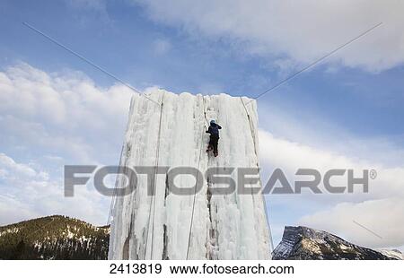 Stock Photo - Ice wall climbing demonstration; Banff, Alberta, Canada. Fotosearch