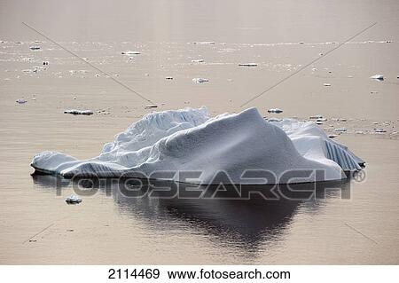 Iceberg And It's Reflection In The Water; Antarctica View Large Photo Image Stock Photo - Iceberg And It's Reflection In The Water; Antarctica. Fotosearch