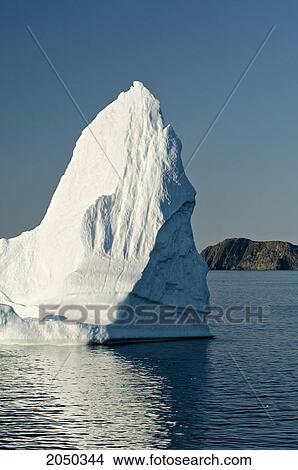 Iceberg Floats In Trinity Bay Off The Bonavista Peninsula Of Eastern Newfoundland View Large Photo Image Picture - Iceberg Floats In Trinity Bay Off The Bonavista Peninsula Of Eastern Newfoundland. Fotosearch
