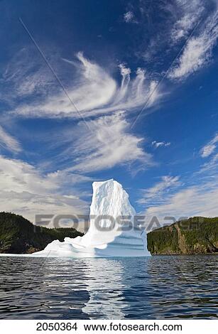 Iceberg Floats In Trinity Bay Off The Bonavista Peninsula Of Eastern Newfoundland View Large Photo Image Picture - Iceberg Floats In Trinity Bay Off The Bonavista Peninsula Of Eastern Newfoundland. Fotosearch