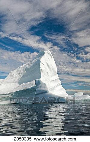 Iceberg Floats In Trinity Bay Off The Bonavista Peninsula Of Eastern Newfoundland View Large Photo Image Stock Photography - Iceberg Floats In Trinity Bay Off The Bonavista Peninsula Of Eastern Newfoundland. Fotosearch
