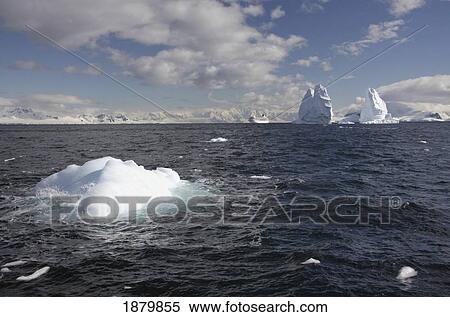 Stock Photography - Icebergs And Cruise Ship In Distance. Fotosearch