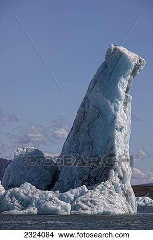 Picture - Icebergs clog the lagoon at Jokulsarlon as they calf off of the Vatnajokull ice cap; Iceland. Fotosearch