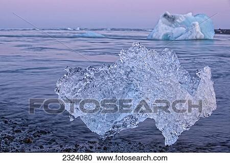 Stock Image - Icebergs on the shoreline of the Atlantic Ocean; Iceland. Fotosearch