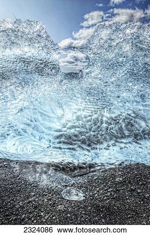 Stock Photograph - Icebergs on the shoreline of the Atlantic Ocean; Iceland. Fotosearch